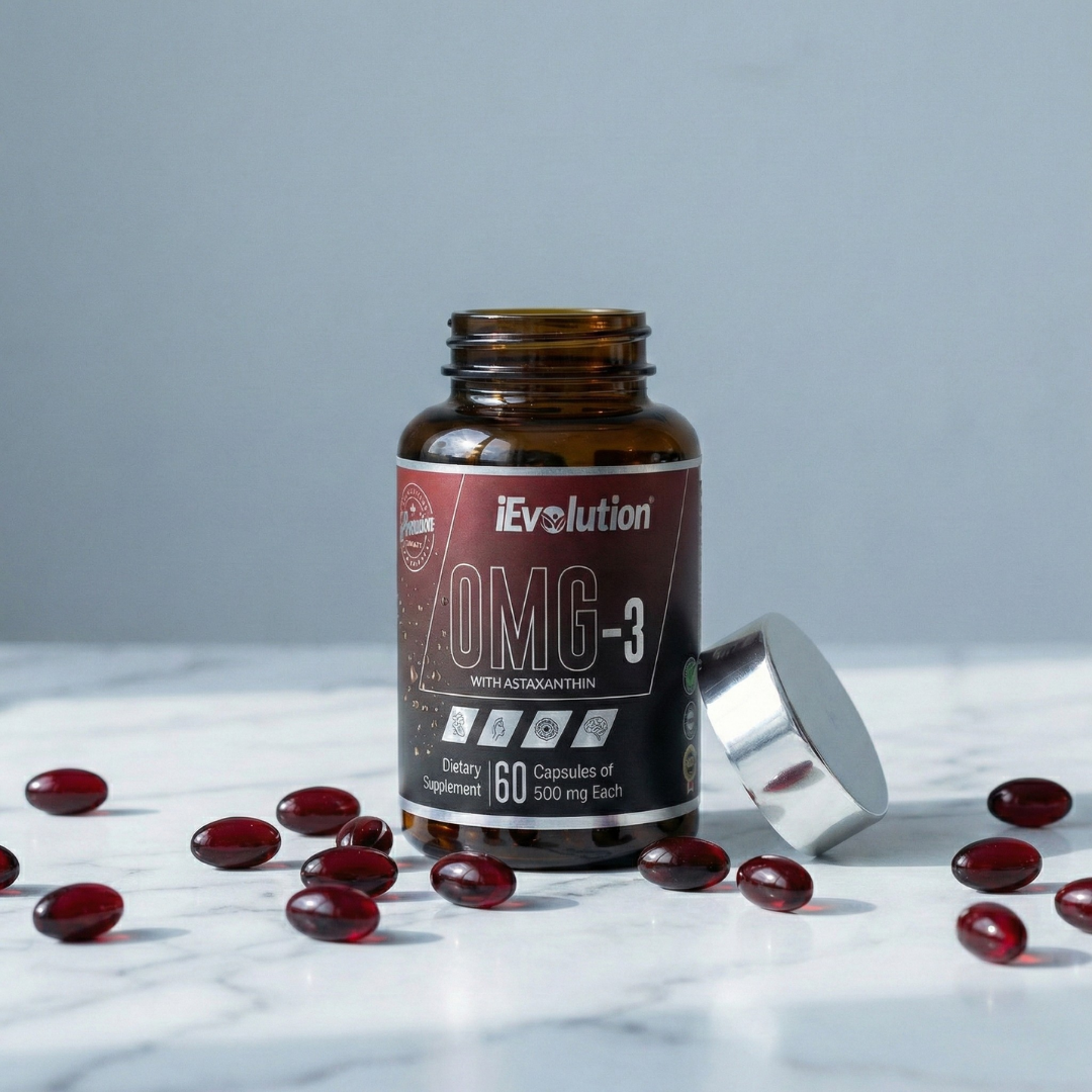 iEvolution OMG-3 deep-red soft-gel capsules pouring from the bottle, highlighting the astaxanthin-rich formula